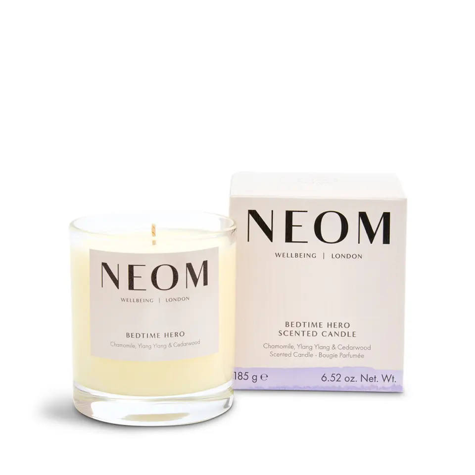 NEOM Bedtime Hero candle, chamomile, ylang ylang, cedarwood, 185g, next to its box.