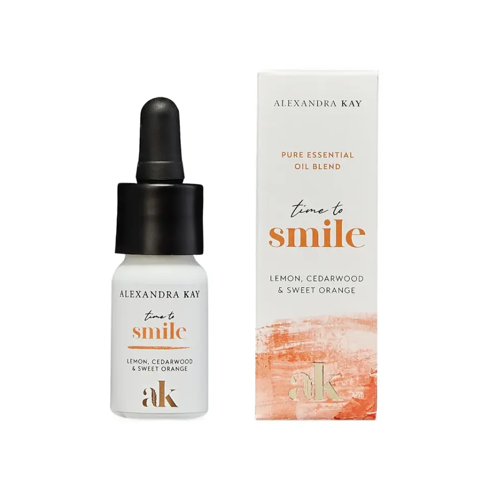 Essential oil bottle and box, "time to smile", lemon, cedarwood, sweet orange.