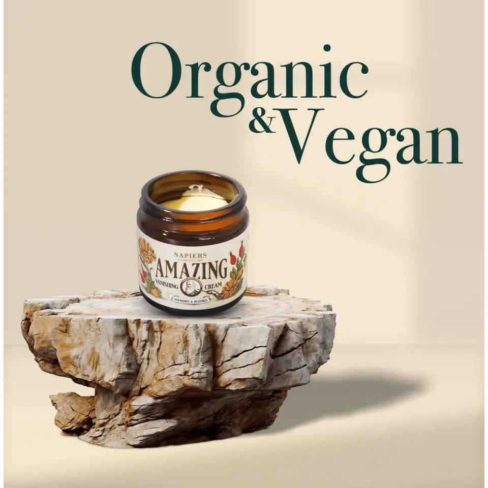 Jar of Napiers Amazing Cream on stone slab, text "Organic & Vegan" in background.