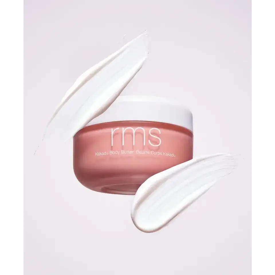 RMS Kakadu Body Butter jar with white cream swirls on a light background.