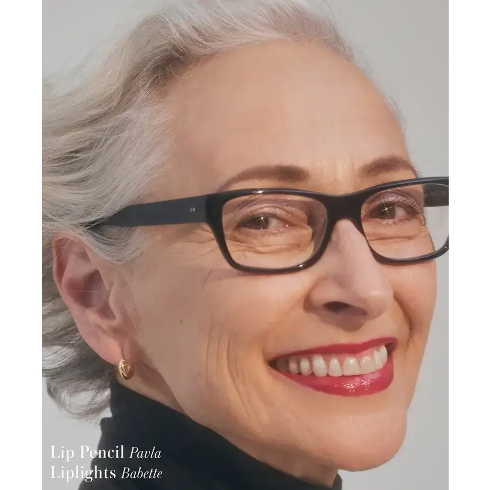 Smiling person with glasses, wearing red lipstick. Text: Lip Pencil Pavla, Liplights Babette.