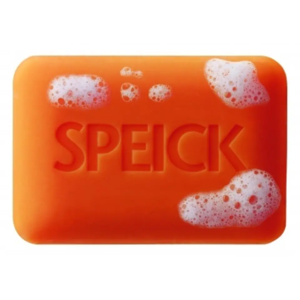 Orange soap bar with "SPEICK" embossed, covered in white foam.