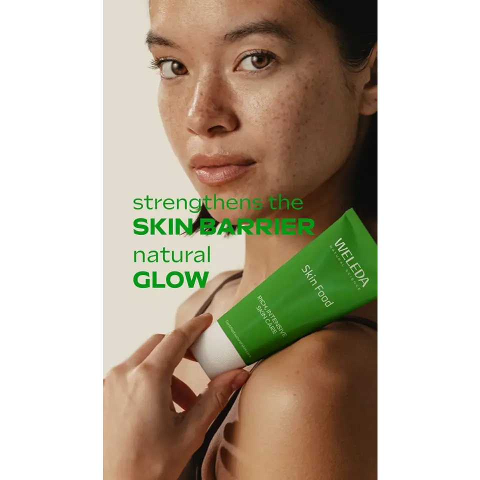 Woman holding Weleda Skin Food tube, text: "strengthens the skin barrier, natural glow".