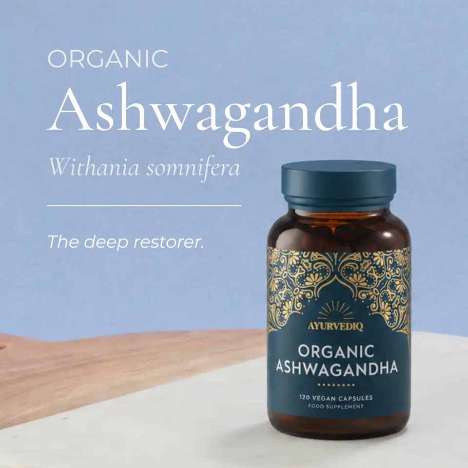 Organic Ashwagandha bottle with decorative label on wooden surface.
