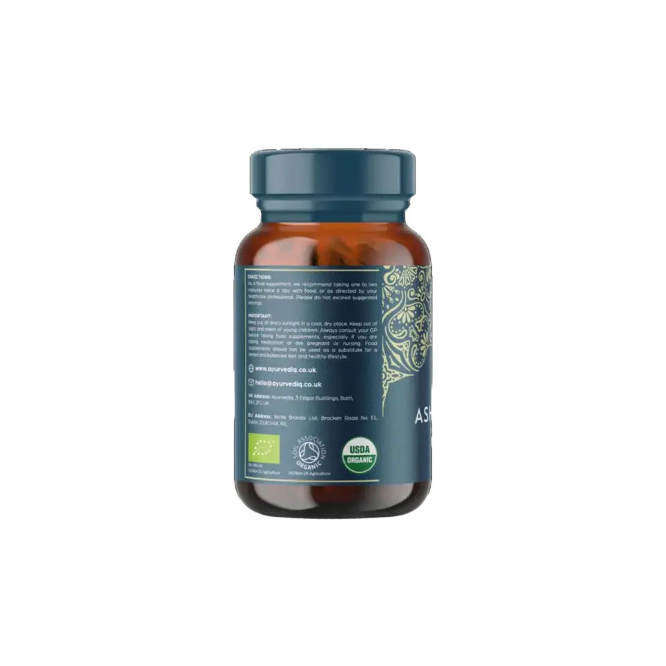 Brown bottle with blue label, organic certification logos, and contact details for Ayurvedic company.