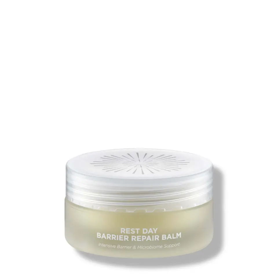 Rest Day Barrier Repair Balm jar with white lid and text on the front.