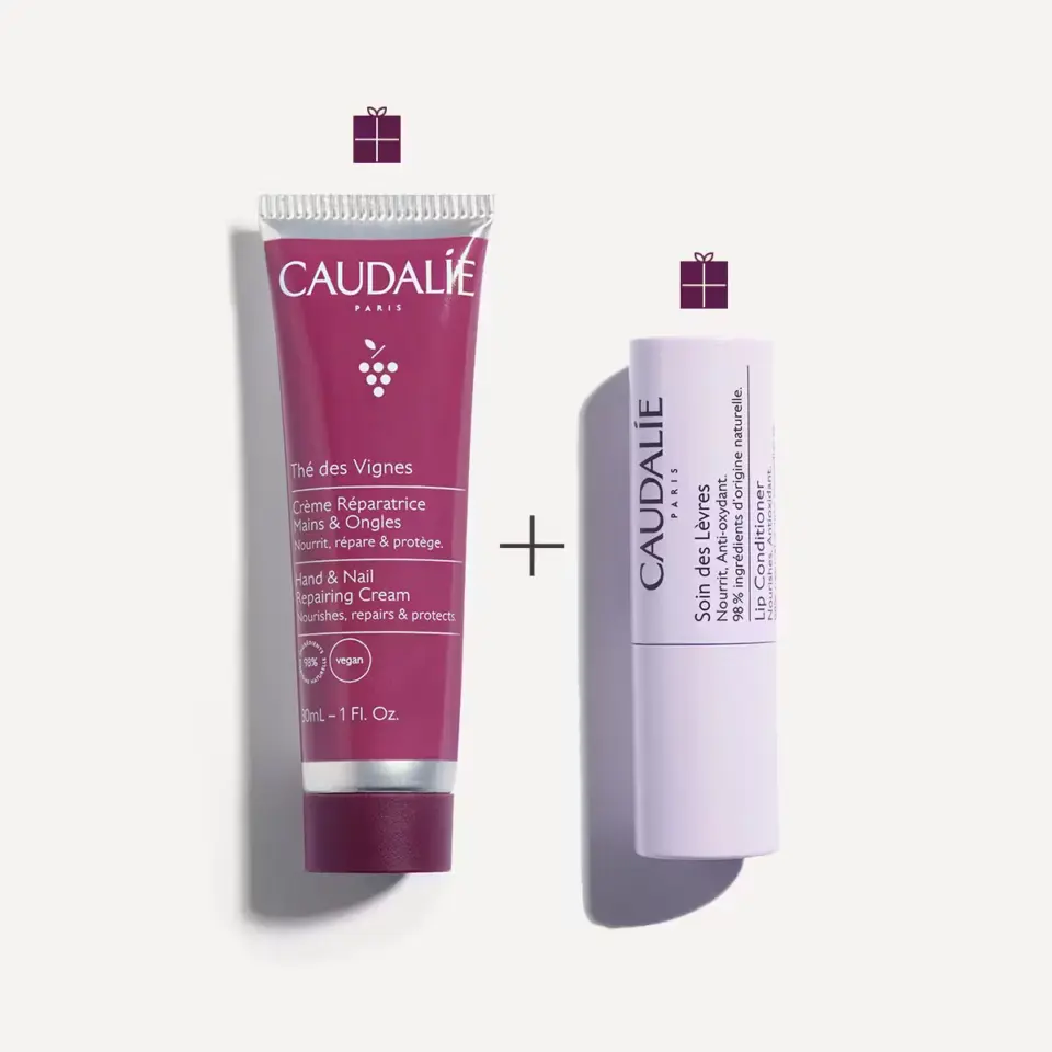 Caudalie hand cream and lip conditioner with gift icons on a white background.