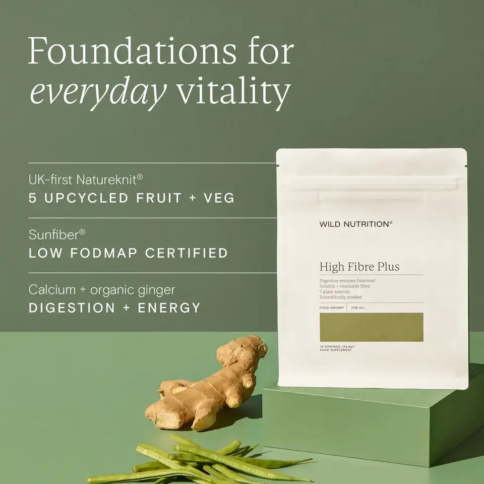 Wild Nutrition High Fibre Plus pouch with ginger and green beans on a green surface.