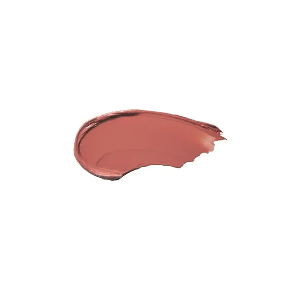 Smear of pinkish-brown cream on white background.