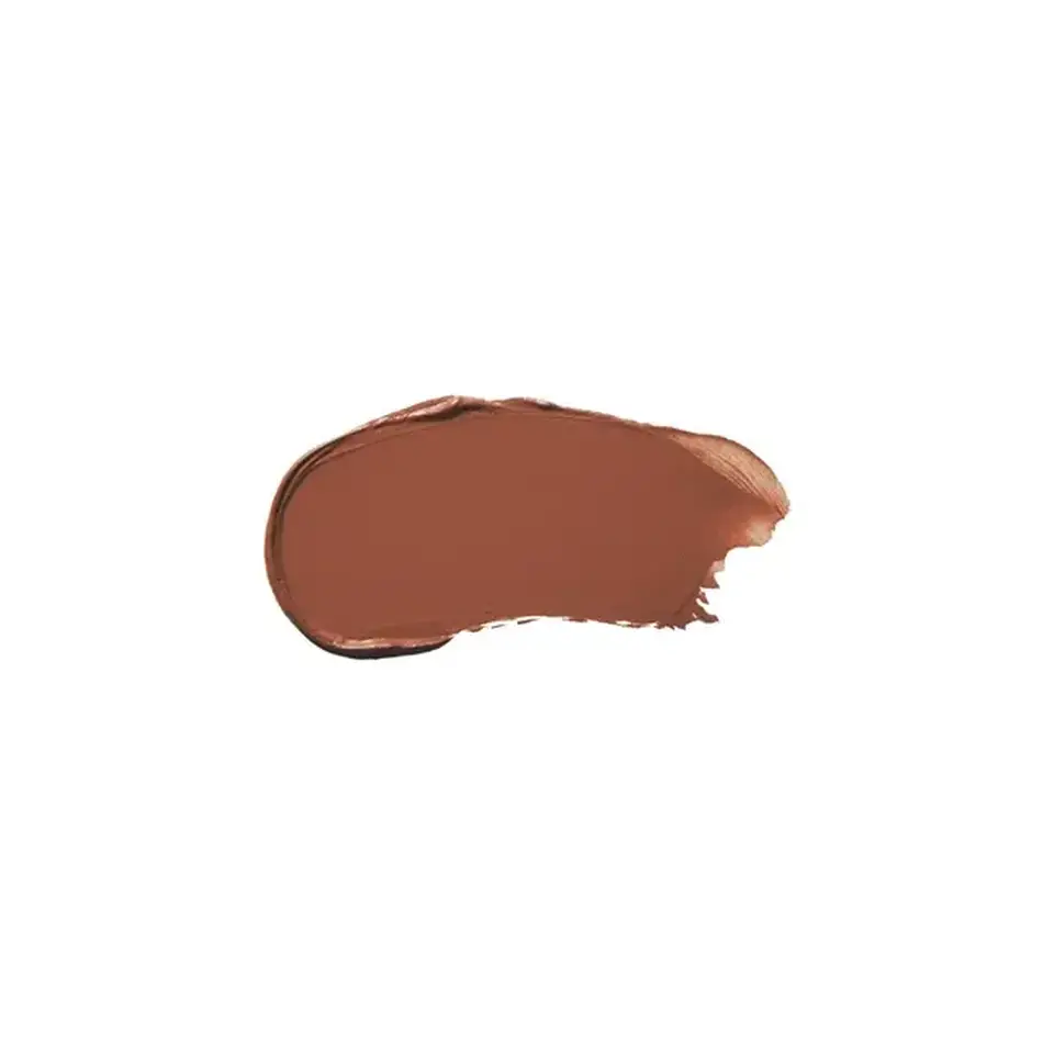 Brown lipstick smear on white background.