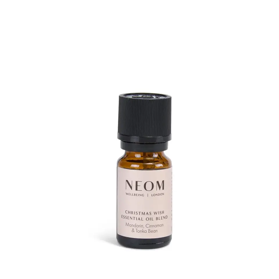 NEOM Christmas Wish essential oil blend bottle with black cap.