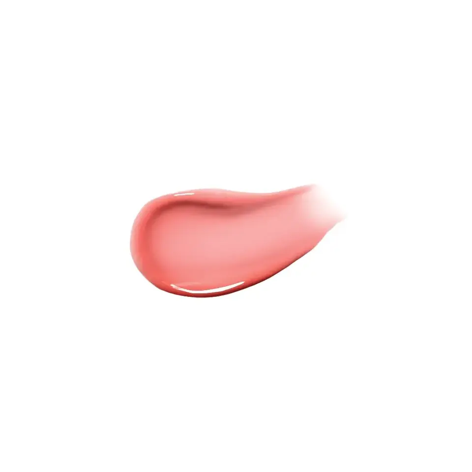 Pink cream smear on white background.