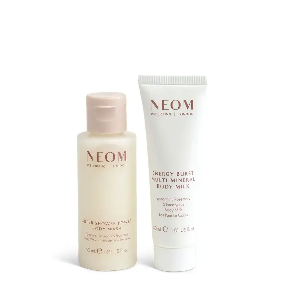 Two Neom products: Super Shower Power Body Wash and Energy Burst Body Milk.