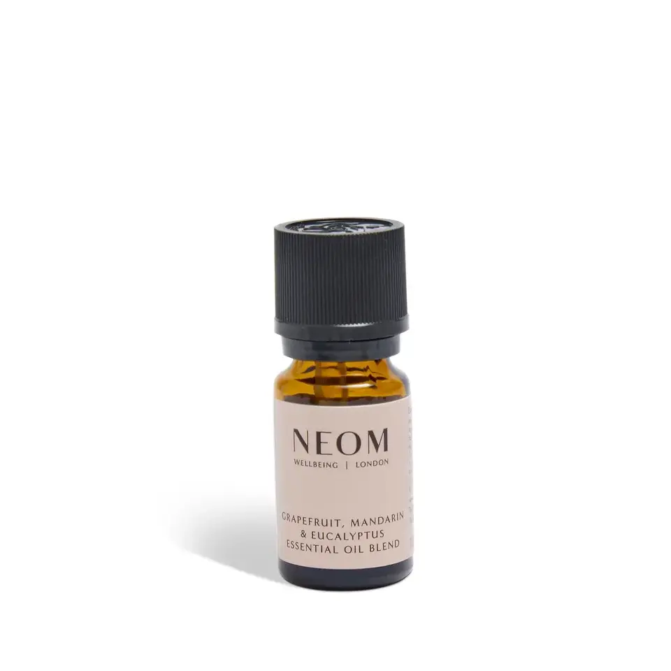 NEOM essential oil blend bottle with grapefruit, mandarin, and eucalyptus.