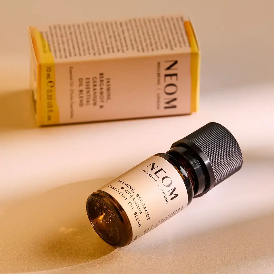 NEOM Jasmine, Bergamot & Geranium essential oil bottle with packaging.