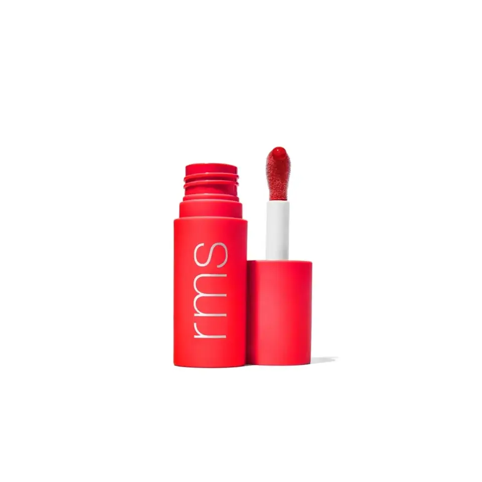 Red lipstick tube with "rms" text, open with applicator showing red lip colour.