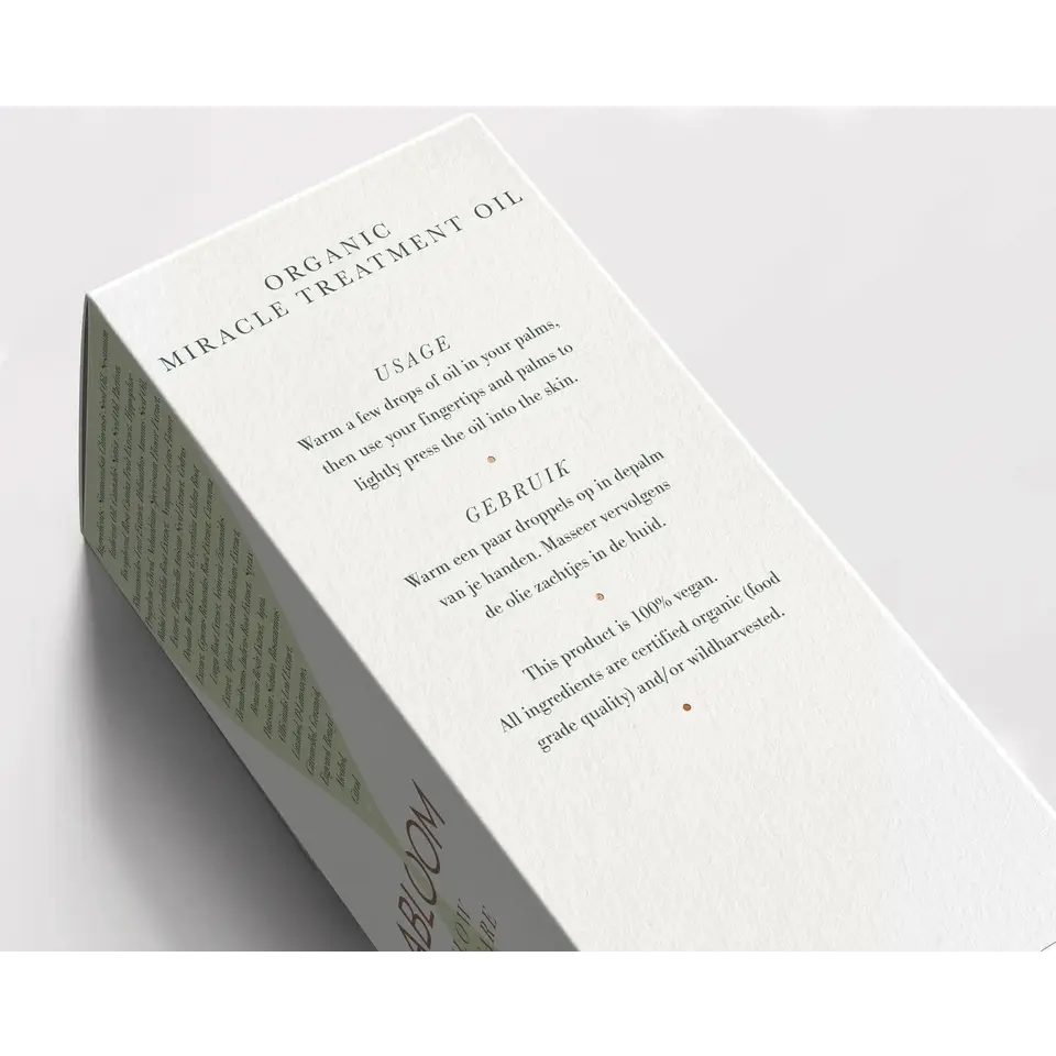 Box of Organic Miracle Treatment Oil with usage instructions in English and Dutch.