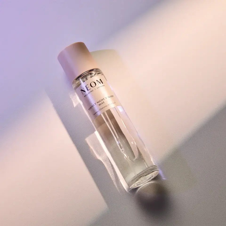 NEOM Perfect Night's Sleep Mist bottle on a light surface.