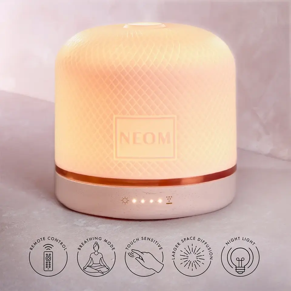 NEOM diffuser with textured surface, remote control, breathing mode, touch sensitive, night light.