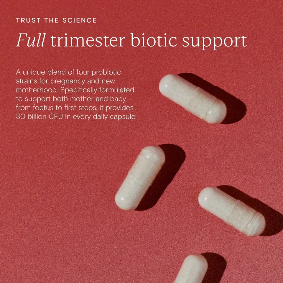 Four probiotic capsules on a red background with text about trimester biotic support.