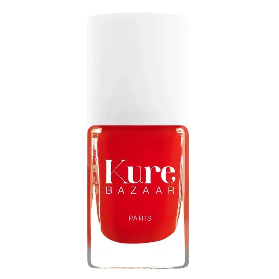 Kure Bazaar red nail polish bottle with white cap.