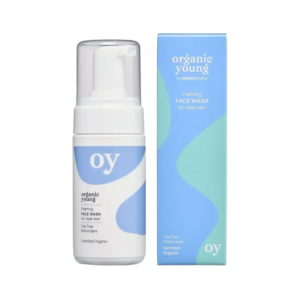 Foaming face wash bottle and box, labelled "oy" and "organic young" with tea tree and willow bark.