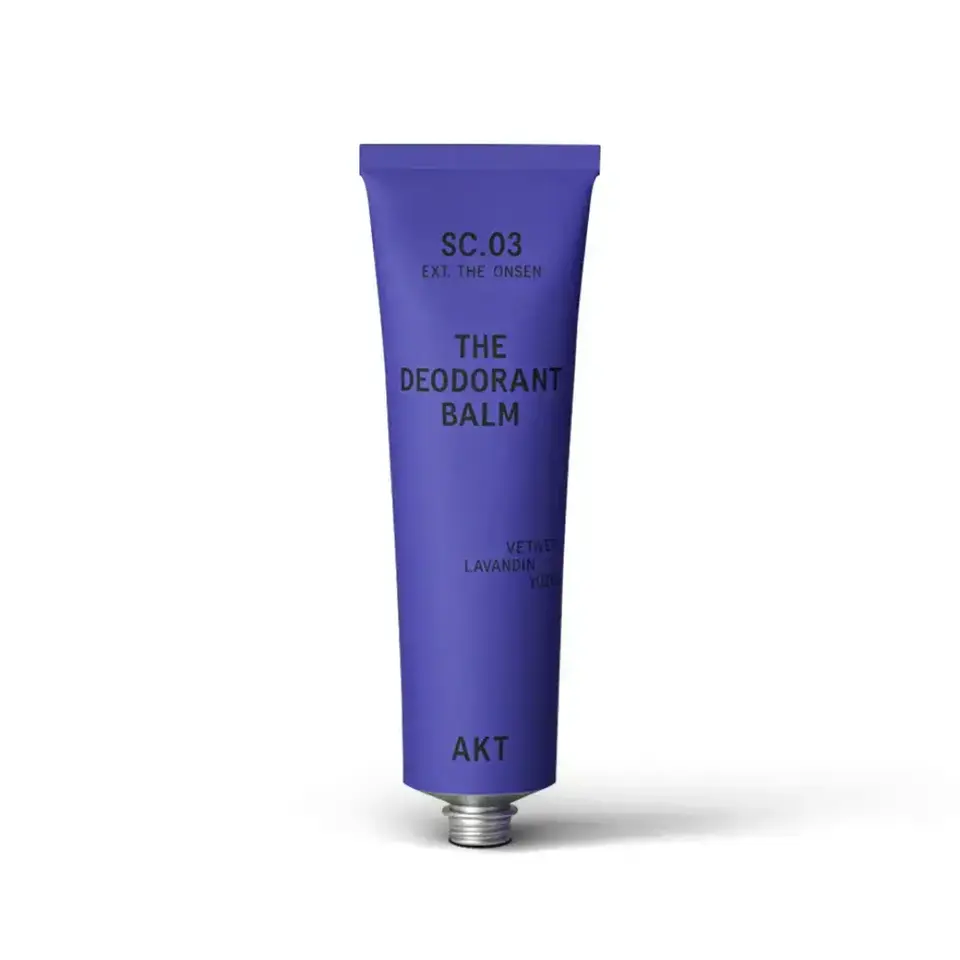 Purple tube labelled "The Deodorant Balm" by AKT, scent: Vetiver, Lavandin, Yuzu.