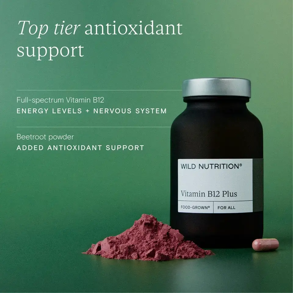 Vitamin B12 Plus bottle with beetroot powder and capsule on green background.