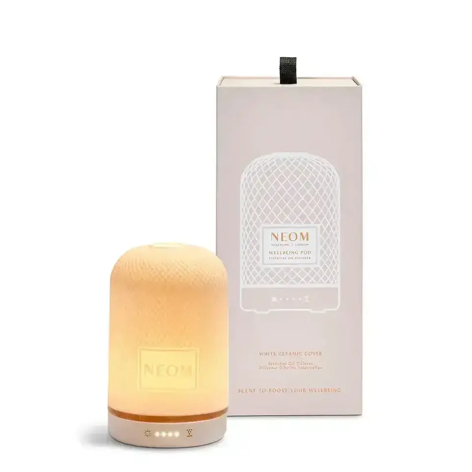 Ceramic essential oil diffuser with packaging, labelled "NEOM Wellbeing Pod".