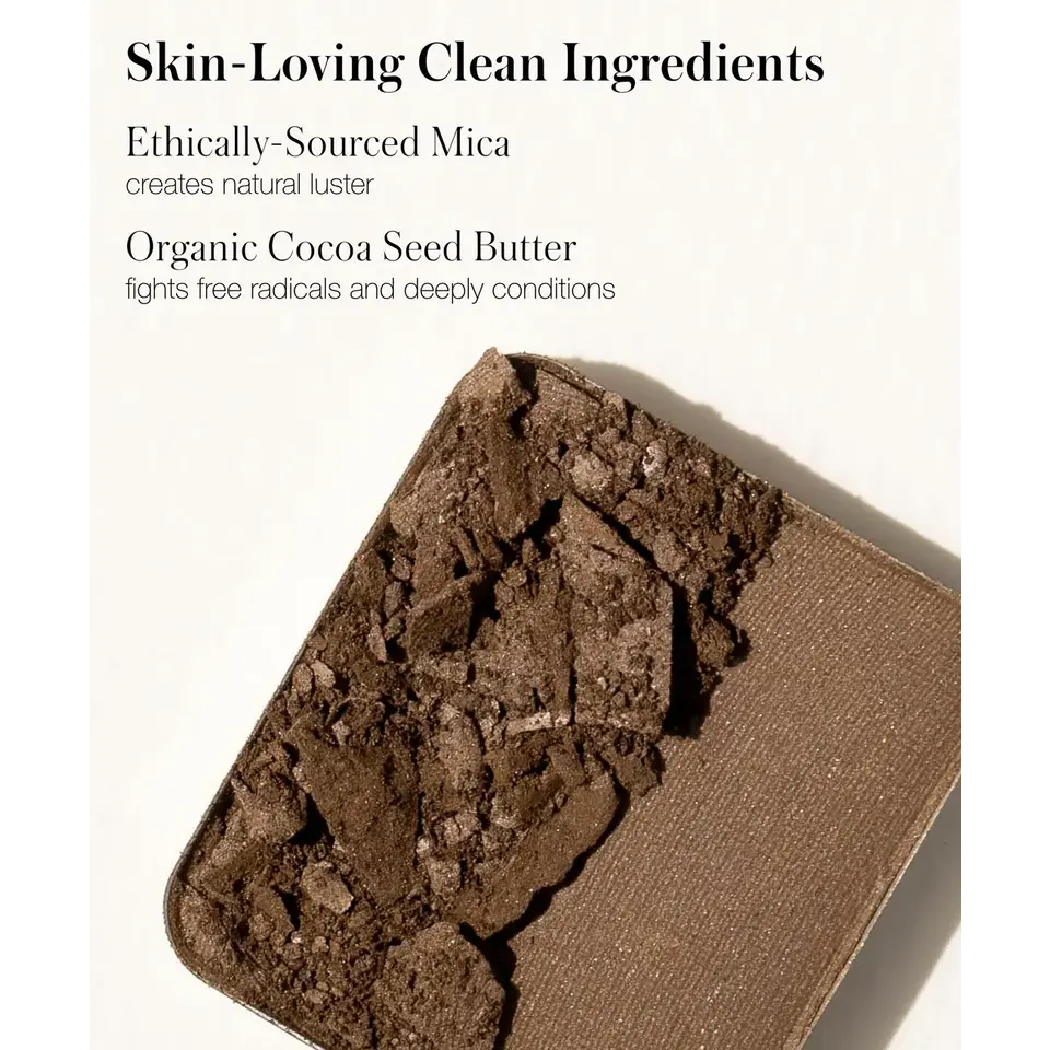 Crushed brown eyeshadow with text about mica and cocoa seed butter benefits.