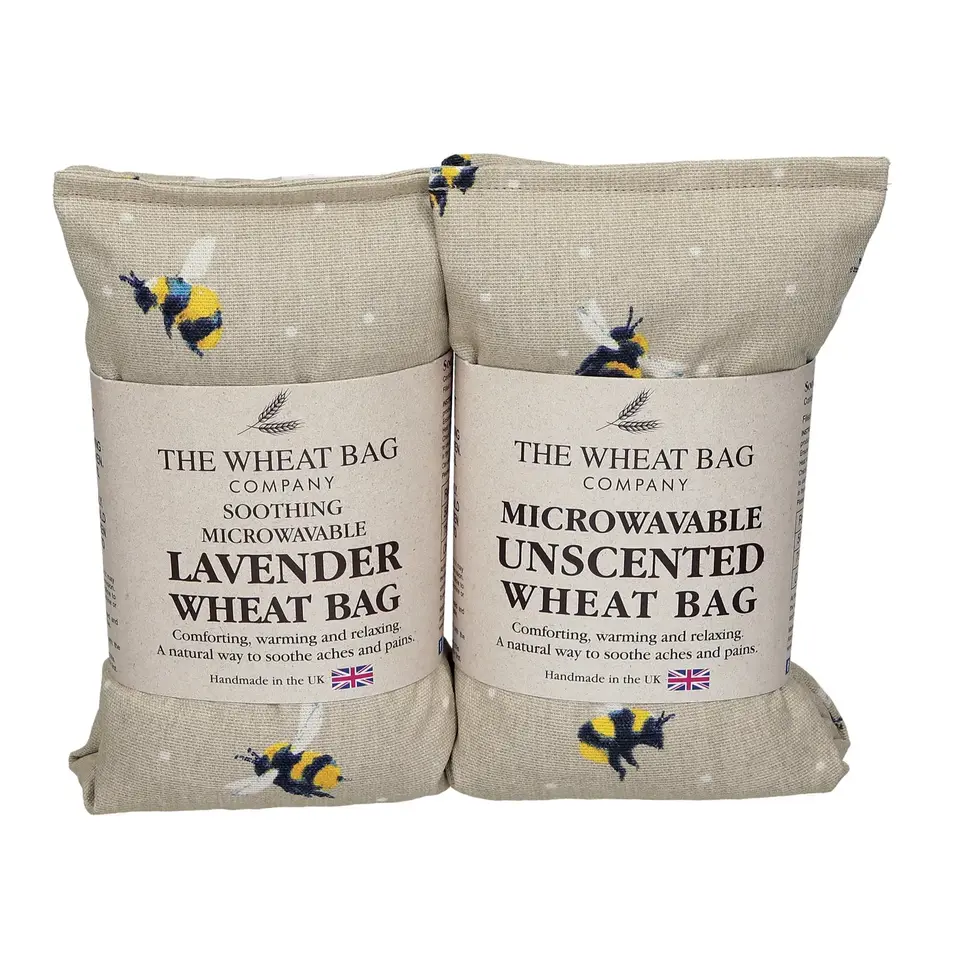 Two wheat bags with bee pattern, labelled lavender and unscented, handmade in the UK.