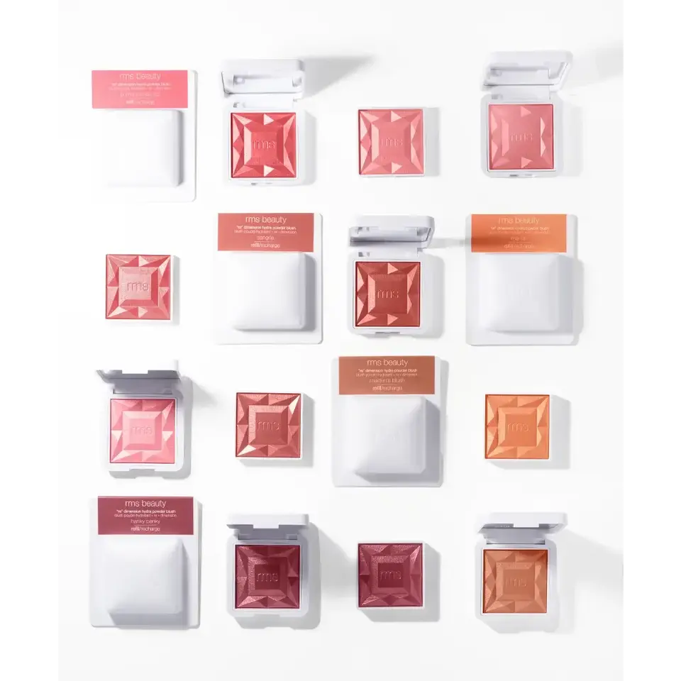 Assorted RMS Beauty blush compacts in various shades arranged in a grid pattern.