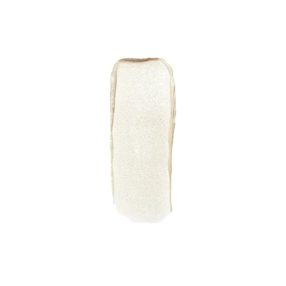 Creamy white skincare product swatch on white background.