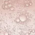 Clear bubbles on a pink liquid background.