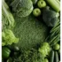 Assorted green vegetables and apples arranged on a grass-like surface.