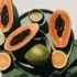 Papaya halves, lime, orange slices, and a whole mango on green fabric.