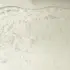Clear gel with air bubbles under a wavy surface.
