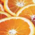 Slices of fresh orange with vibrant orange flesh and white pith.