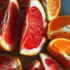 Sliced grapefruit and orange segments arranged on a plate.