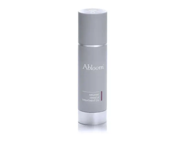 Grey bottle labelled "Abloom Organic Miracle Treatment Oil".