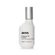 White bottle of aeos Cleansing Oil Dé-Maq, 100ml, with silver cap.