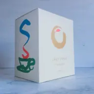 Box with "Lazy Pour Teapot 500ml" text and colourful cup design.
