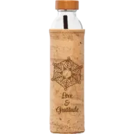Glass bottle with cork sleeve, wooden lid, snowflake design, and text "Love & Gratitude".