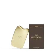 Gold AKT applicator with packaging labelled "The Applicator".
