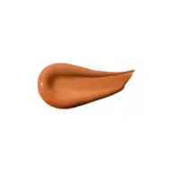 Brown skincare cream smear on white background.