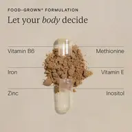 Open capsule with brown powder, labelled nutrients: Vitamin B6, Iron, Zinc, Methionine, Vitamin E, Inositol.