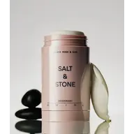 Salt & Stone deodorant with black stones and a white petal.