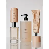 Salt & Stone skincare products: deodorant, body wash, lotion, and fragrance.