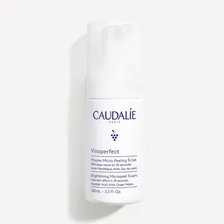 Caudalie Vinoperfect Brightening Micropeel Foam, 100mL bottle, white with blue text.