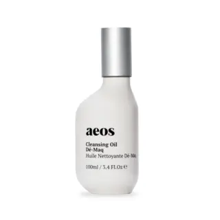 White bottle of aeos Cleansing Oil Dé-Maq, 100ml, with silver cap.